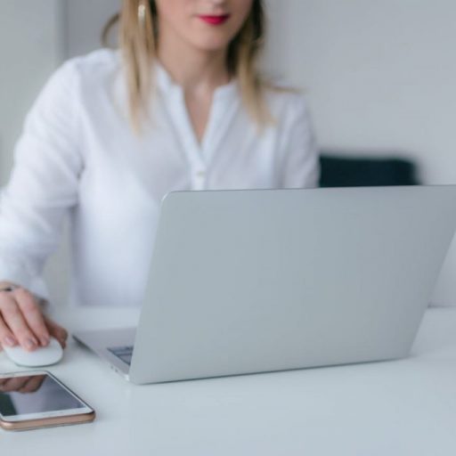 Woman Using Silver Laptop